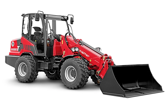 Studio view of the Schäffer 6680 T telescopic wheel loader with standard bucket, showcasing its robust and compact design.