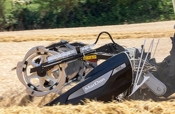 Close-up of the MacDon FD2 header’s end section and reel system, highlighting its flexible design and high-capacity cutting performance.