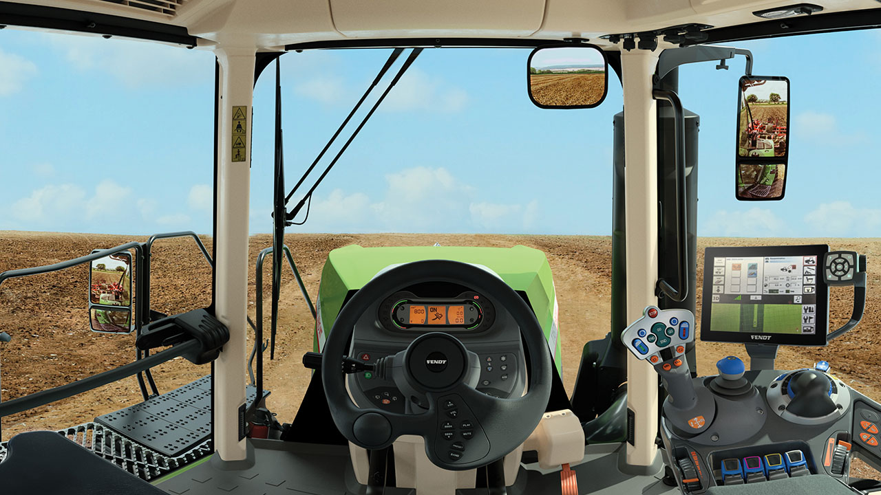 iew from inside a Fendt 900 Vario MT cab showing ergonomic controls, FendtONE display, and high-tech precision farming tools.