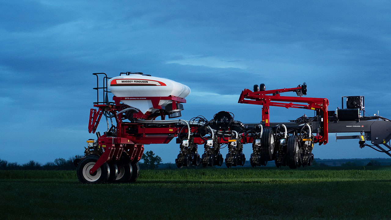 Massey Ferguson planter parked at dusk on a field, showcasing precision ag equipment and AGCO innovation.