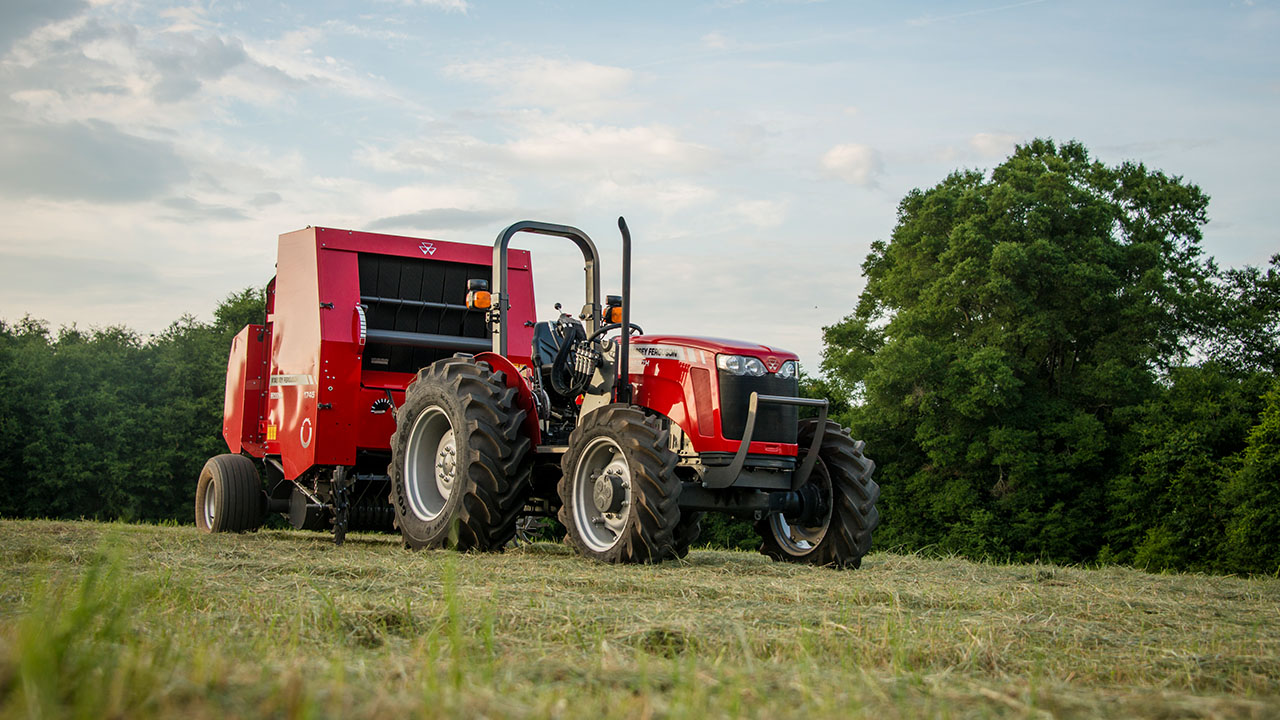 Hesston by Massey Ferguson 1700 Series round baler in hay field, built for efficiency and performance in baling operations.