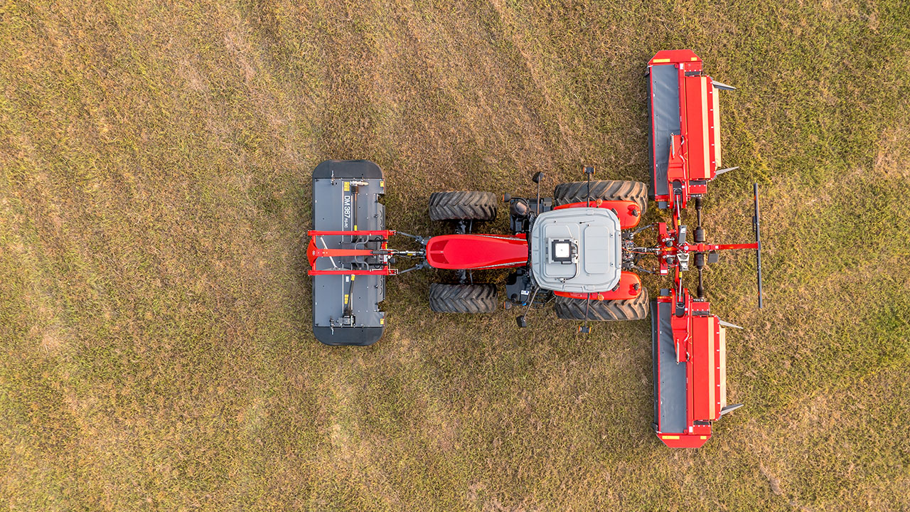 Top view of Massey Ferguson tractor with MF DM Series Triple Mower, delivering wide cutting coverage in a grass field.