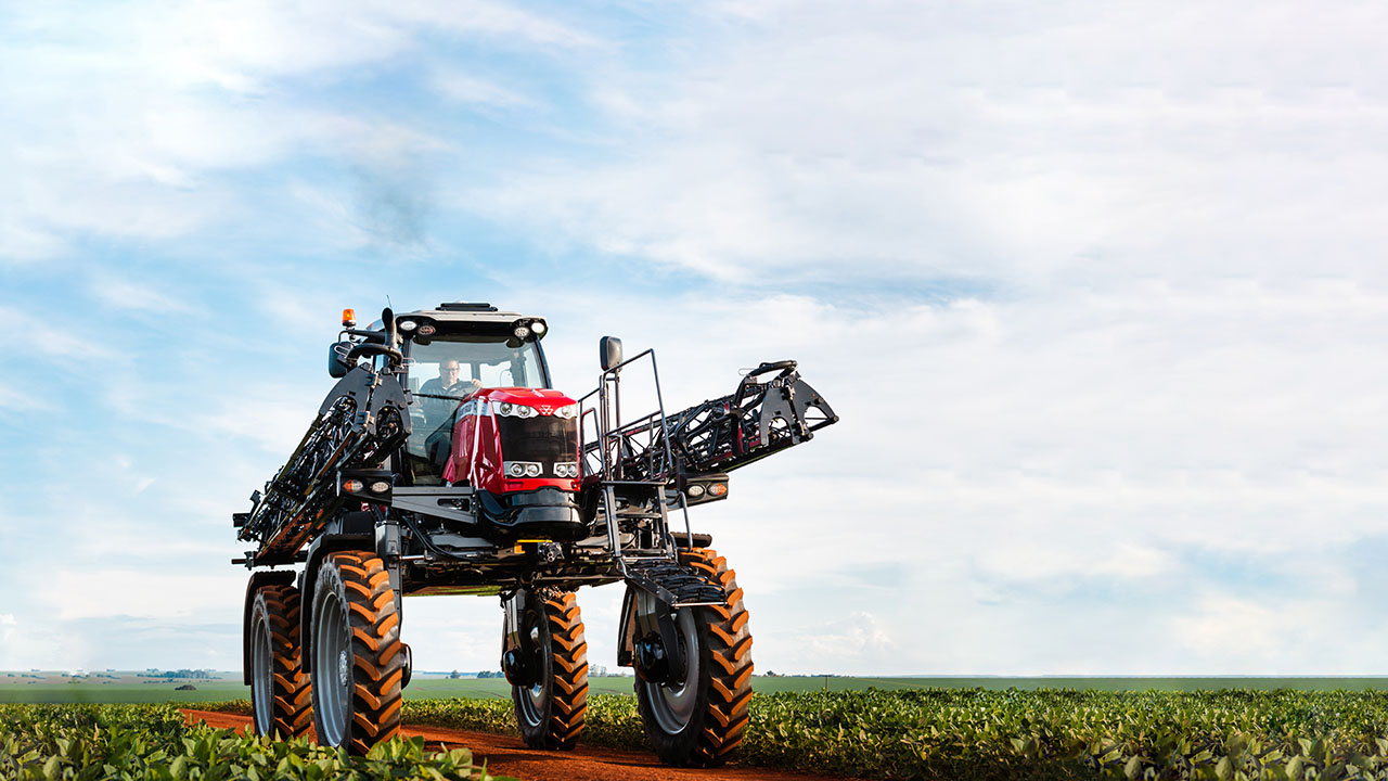 Massey Ferguson 500R high-clearance sprayer in soybean field, delivering precise application for row crop farming efficiency.