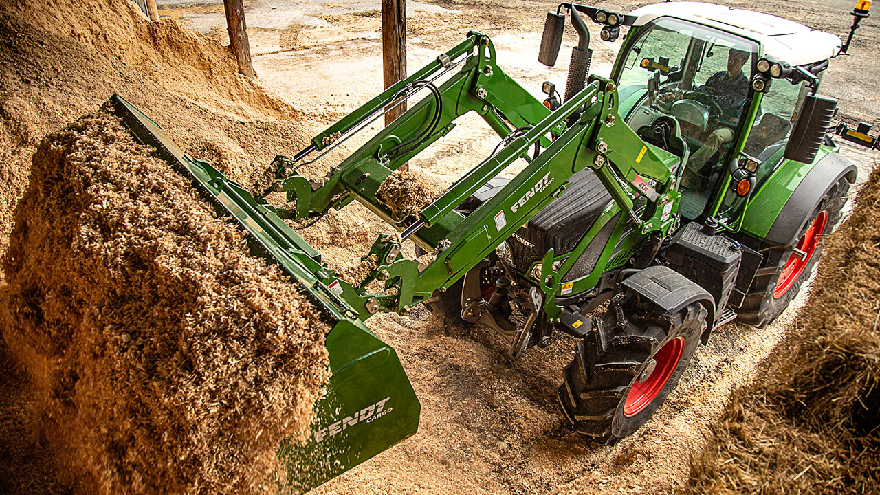 Fendt 500 Vario tractor showcasing AGCO efficiency for barn and material handling tasks.