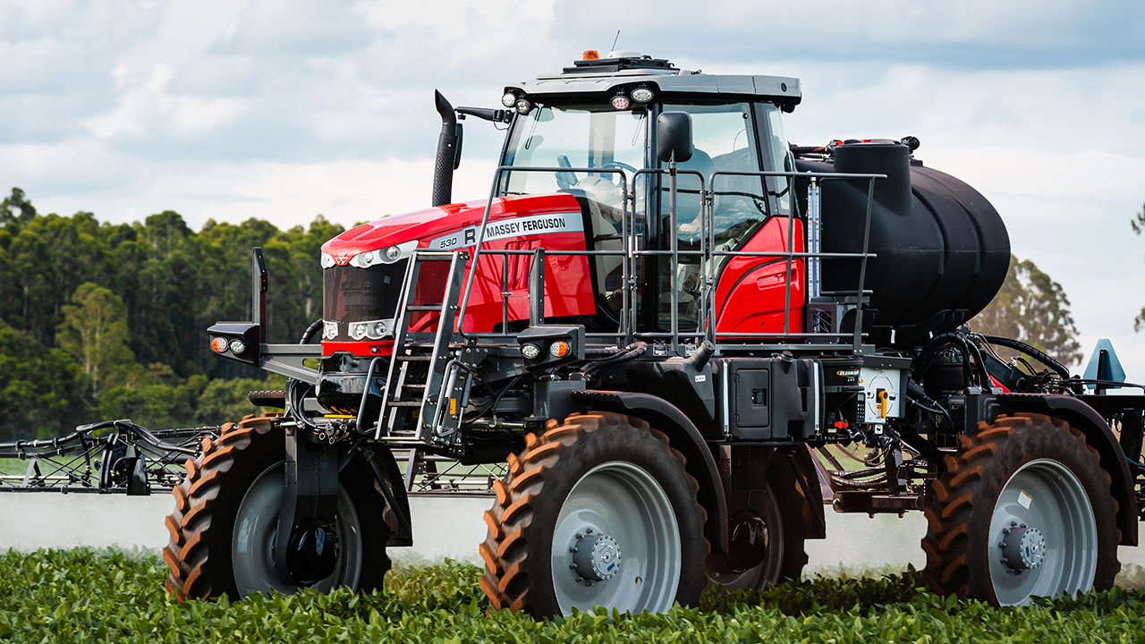 Massey Ferguson 500R sprayer applying crop treatments in a field, designed for precision farming and efficient application.