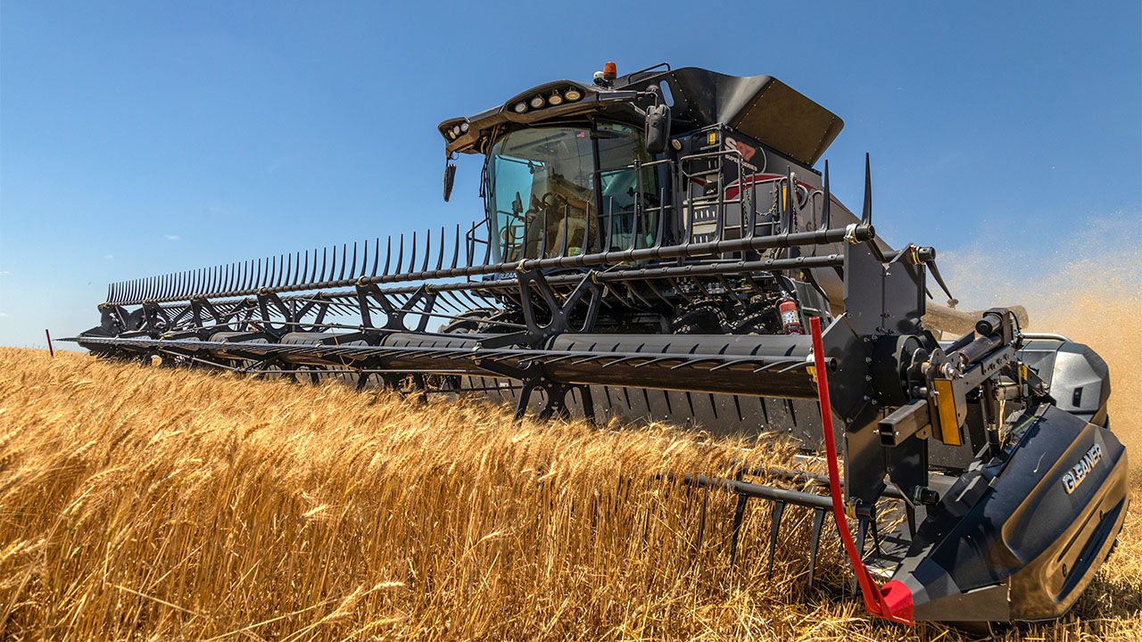 Gleaner combine and header harvesting a crop