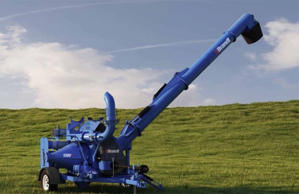 Brandt 1300 GrainVac in a green field, designed for high-efficiency grain cleanup and transfer.