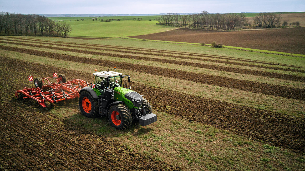 Fendt 1000 Vario tractor pulling Sunflower tillage tool across freshly worked field, built for AGCO precision and power.